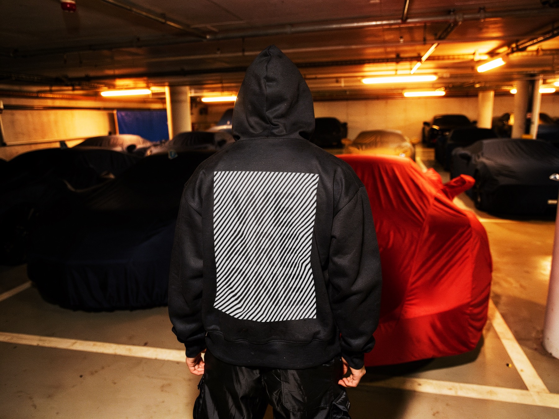 Backpack hoodie in parking garage