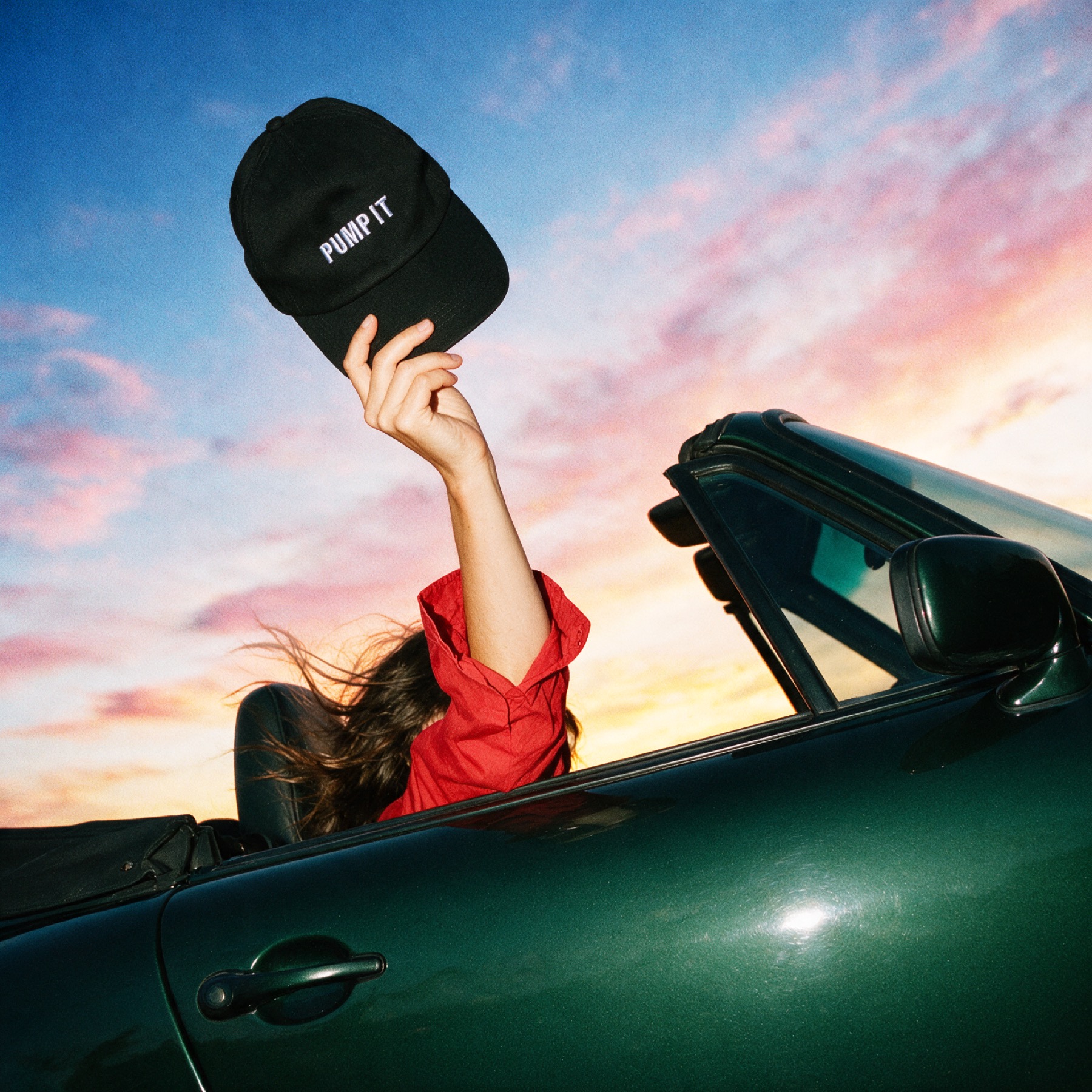 PumpIt cap held from a car window
